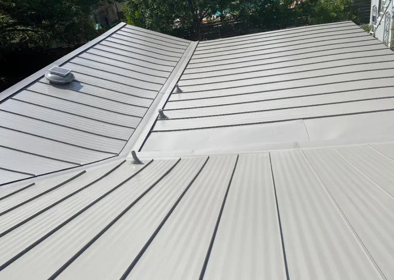 Solar attic fan installed on a metal roof for Roof Ventilation in Ukiah